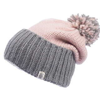 A pink and grey handmade wool beanie with a Masha pom slouch.