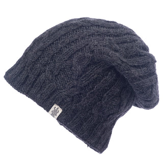 A black Alexander Cable Slouch knit hat with a white logo.