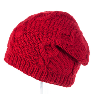 A handmade red knitted Sectional Slouch beanie on a mannequin.
