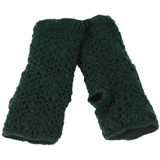 The Flower Crochet Handwarmers, in dark green with a floral pattern and thumb opening, are shown laid flat on a white background.