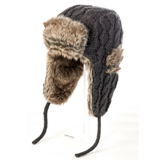 A Cable Knit Russian Hat with faux fur on a stand.