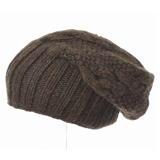 A brown Oversized Cable Merino Slouch hat on a mannequin.