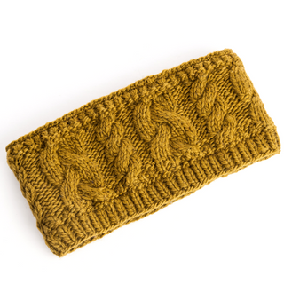 A Carousel Headband with Rib in mustard yellow knitted headband with a cable stitch pattern and fleece lining displayed on a white background.