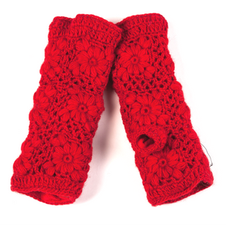 The Flower Crochet Handwarmers are bright red, fingerless wool gloves with a floral pattern, shown flat side by side on a white background—ideal for stylish winter warmth.