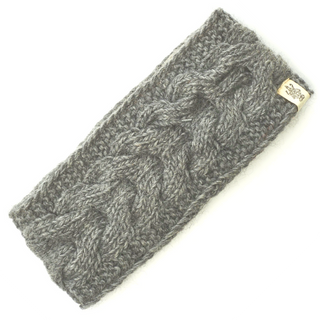 A gray Full Soho headband with a cable knit pattern and a small tag on the side.