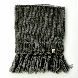 A Sweet Emotions Neckwarmer with tassels displayed against a white background.