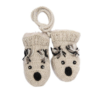 The Crochet Koala Mittens are a pair of beige, knitted baby mittens that feature an adorable animal design with black embroidered facial details like eyes, nose, and ears. Hand-made in Nepal from 100% wool, these mittens are conveniently connected by a knitted string.