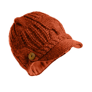 The Broadway Hat is a red cable knit hat featuring a short brim and a decorative wooden button on the side, shown against a white background.