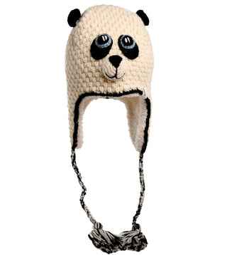 Introducing the Crochet Panda Hat: This hand-made hat is designed to resemble a panda bear, featuring a cream-colored base with charming black ears, eyes, and nose. The hat includes cozy ear flaps and two braided strings that culminate in black and white pom-poms. Crafted from 100% wool, it ensures both warmth and comfort.