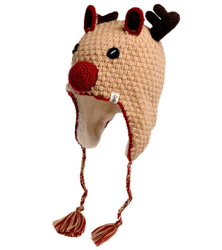 The Crochet Reindeer Hat is a handmade, beige crocheted hat from Nepal, designed to look like a reindeer with antlers, ears, a large red nose, and black eyes. It features ear flaps and braided tassels on each side for extra charm.