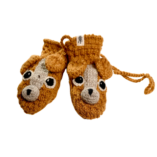 Introducing the Crochet Lucy Puppy Mittens, a pair of light brown, knitted mittens featuring charming dog faces with big black and white eyes, floppy ears, and light gray snouts. Complete with attached strings and handmade in Nepal, these cozy sherpa-lined mittens are perfect for keeping a child's hands warm.