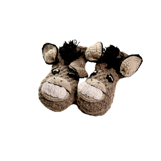 A pair of sherpa-lined crochet mittens designed to look like donkeys. The mittens have cartoonish donkey faces with black manes, large white teeth, and black nostrils. Handmade in Nepal, the solid black background makes these crochet wool mittens stand out prominently.