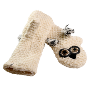 A pair of Crochet Owl Mittens, hand-made in Nepal, feature a cream-colored design with one mitten folded and the other displaying a crochet owl face adorned with large eyes and tassel-like ears, set against a black background.