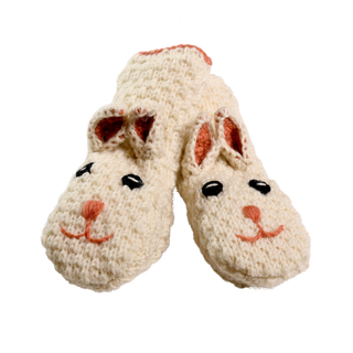 A pair of Crochet Rabbit Mittens in a cozy cream color, designed to resemble cute bunnies. The mittens feature embroidered faces with black eyes, pink noses, and adorable sewn-on ears with pink inner detailing. These charming pieces exude the quality and charm of hand-made items from Nepal.