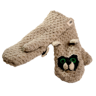 A pair of "Crochet Rockey Racoon Mittens" in beige, featuring a woolly texture and handmade craftsmanship from Nepal. One mitten is adorned with a cartoon raccoon face, complete with green eyes, black patches around the eyes, and small ears on top. These sherpa-lined mittens not only keep hands warm but also add a playful touch to winter outfits.