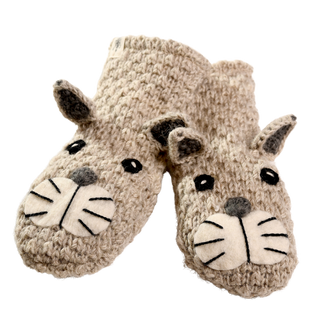 A pair of beige, knitted children's slippers designed to look like anteaters. Hand-made in Nepal, the slippers feature small, felt eyes, whiskers, and protruding ears and snouts for added detail. Labeled as "Crochet Shmil the Cat Mittens," the image showcases the product against a plain white background.