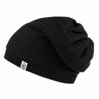 Hand Loom Dekalb Slouch is a black, hand-knit slouchy beanie with ribbed edging and a small white fabric tag on the front, shown against a plain white background.