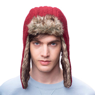 A man wearing a red Winter trapper hat.