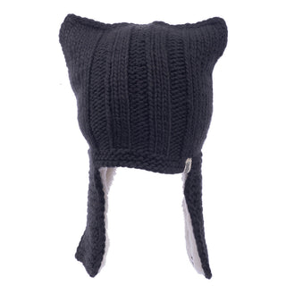 A handmade black wool knitted Illyrian helmet earflap.