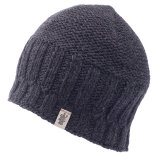 A black Percy beanie made of merino wool on a white background.