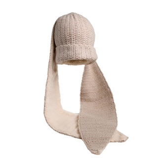 The Oversized Ear Beanie in beige features a knitted hat with a ribbed brim and a textured pattern, paired with an attached scarf lined in plush, soft material. The scarf loops downward, suggesting both warmth and thickness.