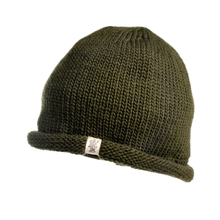 A close-up image of the Baxter Hat, a green winter beanie made of thick, warm Merino Wool, featuring a rolled brim and a small white tag displaying a logo near the bottom edge. The background is completely black.