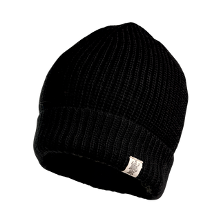 The Bond Hat is a black ribbed-knit winter beanie featuring a folded brim. Adorning the front of the brim is a small white fabric tag with a logo. Crafted from soft Merino Wool, this beanie stands out against a plain black background.