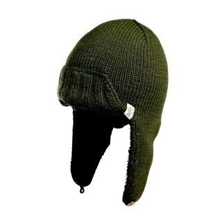 The Essex Hat, crafted in a rich dark green hue, features extended ear flaps and a string tie for secure wear. Made from hand-knit materials with a textured knit finish, the hat includes a small white tag on its left side. The ear flaps hang down naturally, and the string is looped to fasten the hat under the chin against a plain black background.