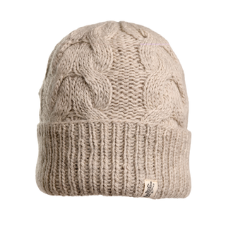 The Lenox Hat is a beige knit beanie made from high-quality wool, featuring a ribbed band at the bottom and a zigzag pattern across its body. It includes a small white tag with the logo attached to the ribbed section for added cozy comfort.