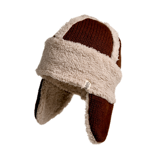 The Arthur Hat is a brown and beige trapper winter hat with a fuzzy, textured exterior made from Merino wool. It features Sherpa fleece ear flaps and a thick band around the forehead area.