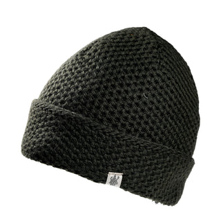 Hand Knit Baltic Hat in dark green wool with a folded cuff and a small square label on the front.