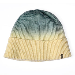 Introducing the Hand Knit Flow Hat—a cozy ombre knit hat showcasing a striking gradient that transitions seamlessly from green at the top to yellow at the bottom, and finished with a small cuff tag featuring a black logo.