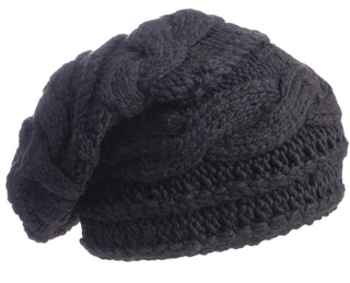A close-up of the Triple Braid Cable Slouch, a black hand-knit beanie from Nepal featuring a textured cable-knit pattern, shown on a white background.