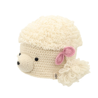 Crocheted beige child's Poodle hat designed to resemble a sheep with fluffy yarn details and a pink ear accent.