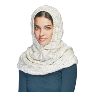 A woman wearing a white, fleece-lined Chunky Hood w/ Button.