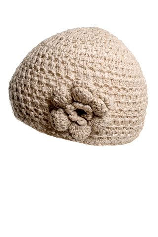 Introducing the Flower Beanie from our summer collection—a beige, hand-crocheted hat that boasts a unique textured pattern and a charming crocheted flower on one side. This snug, rounded hat with a flat crown is perfect for adding a touch of handcrafted charm to your warm-weather outfits.