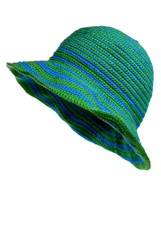 The Stripped Sun Hat features alternating green and blue horizontal stripes on a knitted design. It boasts a wide, floppy brim and is made from a textured, yarn-like material, set against a white background.