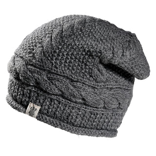 The Gateway Hat is a gray knitted beanie with a braided cable pattern, ribbed edge, and a small rectangular fabric logo tag on the side, shown on a white background.