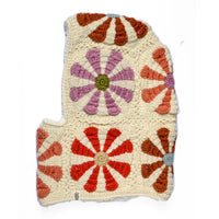 Introducing the Hand Crochet Petal Hood: a hand-crafted piece with an irregular, angular silhouette and softly rounded edges. This hood features a cream background adorned with flower motifs in orange, red, and lavender—reminiscent of classic crochet daisies—arranged in a tidy grid pattern.