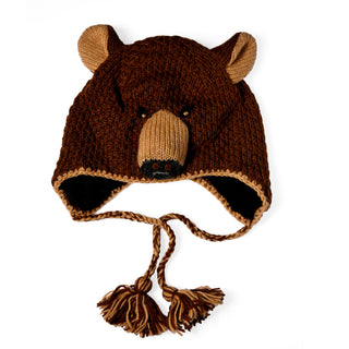Introducing the Hand Crochet Grizzly Hat—a cozy, hand-crocheted wool hat designed to resemble a bear’s face with charming small ears, a snout, black button eyes, and braided tassels finished with pom-poms hanging from the earflaps. Its rich texture and warmth stand out against a simple white background, ensuring all eyes are on this adorable accessory.