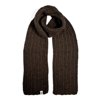 A Hand Crochet Velour Scarf in dark brown is laid out flat on a white background. The scarf showcases a thick, ribbed crochet texture and has a small white tag sewn onto one end.