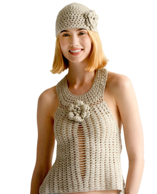 A woman with shoulder-length blonde hair is wearing a crocheted beige sleeveless Collar Top and a matching crocheted hat with a flower detail. She is smiling in front of a plain white background.