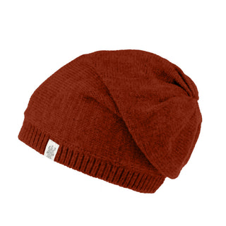 The Dekalb Slouch is a red hand-knit Merino wool beanie with a ribbed edge and a small white cuff tag, shown against a plain white background.