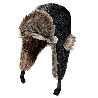 The Winter Trapper Hat is a dark gray knit hat with faux fur lining, ear flaps, and braided chin ties. Handmade in Nepal, it is shown against a plain white background.