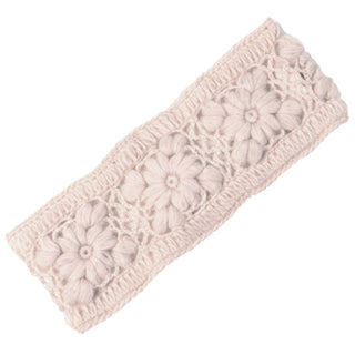 The Flower Crochet Headband- SOLIDS is a light beige, crocheted wool accessory adorned with a pattern of three large flowers in the center. Handmade in Nepal, it boasts an intricate floral design and offers a soft, cozy texture.