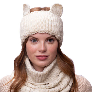 A woman wearing a Kitty ears headband and scarf, both made of wool.