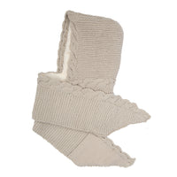 A beige Hand Knit 2 Pocket Scarf Hood made from merino wool with textured patterns, scalloped edges, and a pointed hood lined in soft white sherpa. Handmade in Nepal, it is displayed flat against a white background.