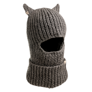 The Hood With Horns is a handcrafted wool hood with pointed ears, featuring a ribbed texture and an opening for the eyes and nose. Made from gray yarn, this winter accessory extends downward to cover the neck, ensuring warmth and style.