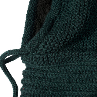 Close-up of the Hand Knit Halo Reverse Hood in dark green, featuring a partially visible drawstring on the left side that accentuates the detailed texture, intricate stitching patterns, and meticulous craftsmanship of this hand-knit piece.