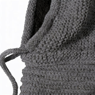 Close-up of the Hand Knit Halo Reverse Hood in textured gray, featuring a drawstring threaded through a channel. The tightly woven pattern highlights visible stitches, showcasing detailed hand knitting.